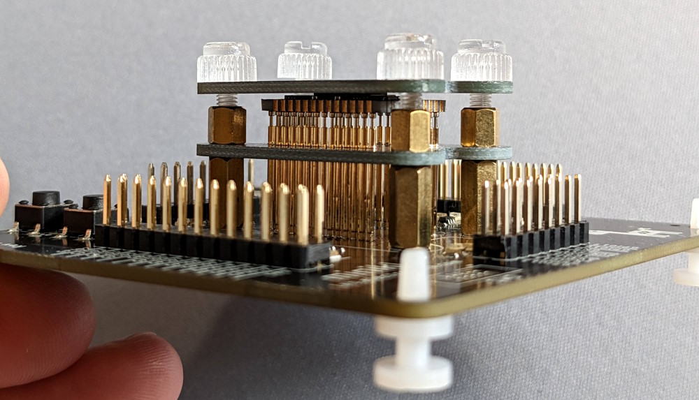 minik module sandwiched between the pogo pins and an extra PCB